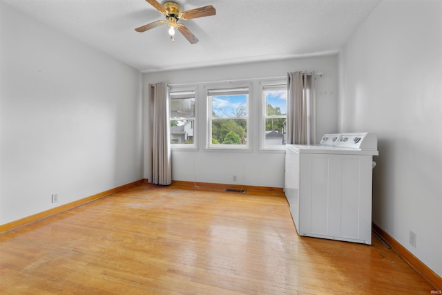 501 N Van Buren St, Auburn, IN 46706 - empty room featuring washer / clothes dryer, ceiling fan, and light wood-style flooring