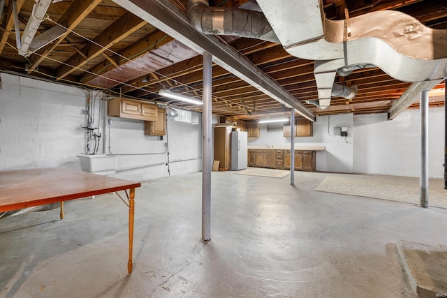 501 N Van Buren St, Auburn, IN 46706 - unfinished below grade area featuring freestanding refrigerator