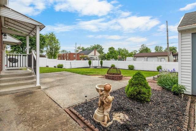 501 N Van Buren St, Auburn, IN 46706 - fenced backyard with a fire pit and a patio area