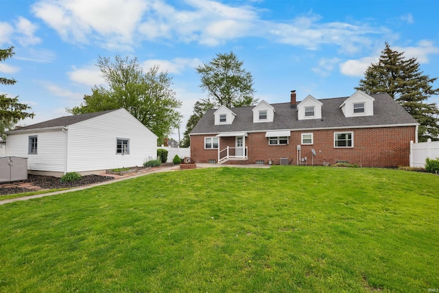 501 N Van Buren St, Auburn, IN 46706 - back of house with a chimney, brick siding, and an outdoor structure