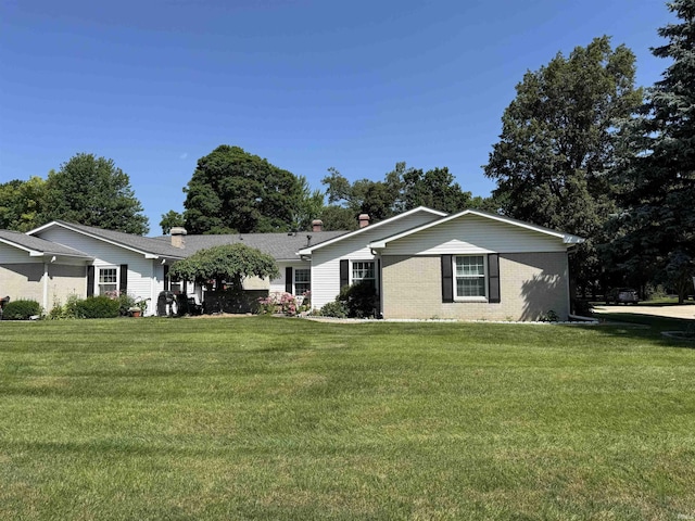 4329 Rutgers Dr Unit 40B, Anderson, IN 46013 - ranch-style home featuring a front yard, brick siding, and a chimney