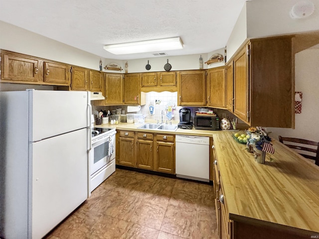 4329 Rutgers Dr Unit 40B, Anderson, IN 46013 - kitchen featuring white appliances, under cabinet range hood, butcher block countertops, brown cabinetry, and a textured ceiling