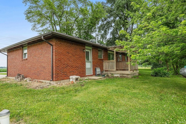 8416 S 400 W, Lafayette, IN 47909 - back of property featuring a lawn, brick siding, and a deck
