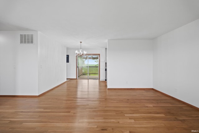 8416 S 400 W, Lafayette, IN 47909 - spare room featuring a chandelier and light wood-style flooring