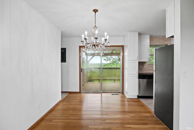 8416 S 400 W, Lafayette, IN 47909 - unfurnished dining area featuring light wood-style floors and a chandelier