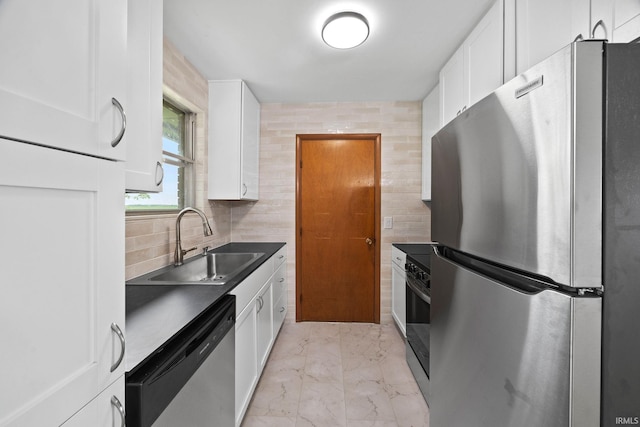 8416 S 400 W, Lafayette, IN 47909 - kitchen featuring stainless steel appliances, light marble finish flooring, white cabinets, and decorative backsplash