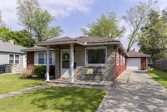 1621 E Madison St, South Bend, IN 46617 - view of front of property featuring stone siding, concrete driveway, roof with shingles, and a garage