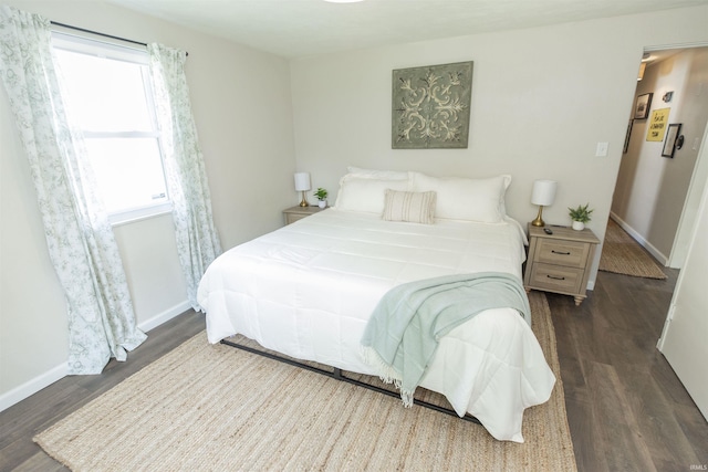 1621 E Madison St, South Bend, IN 46617 - bedroom with dark wood-style floors and baseboards