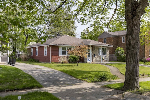 1621 E Madison St, South Bend, IN 46617 - view of front facade featuring a front yard, driveway, and a shingled roof