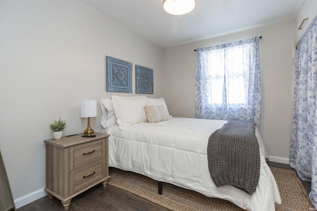 1621 E Madison St, South Bend, IN 46617 - bedroom featuring dark wood-type flooring and baseboards