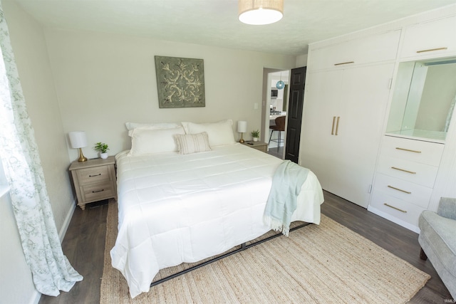 1621 E Madison St, South Bend, IN 46617 - bedroom with dark wood-style flooring and baseboards