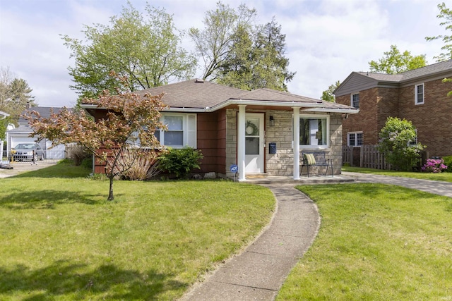 1621 E Madison St, South Bend, IN 46617 - bungalow-style house with stone siding and covered porch