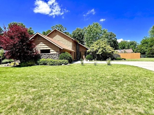 408 Duryea Dr, Auburn, IN 46706 - view of front of house with stone siding and a front lawn