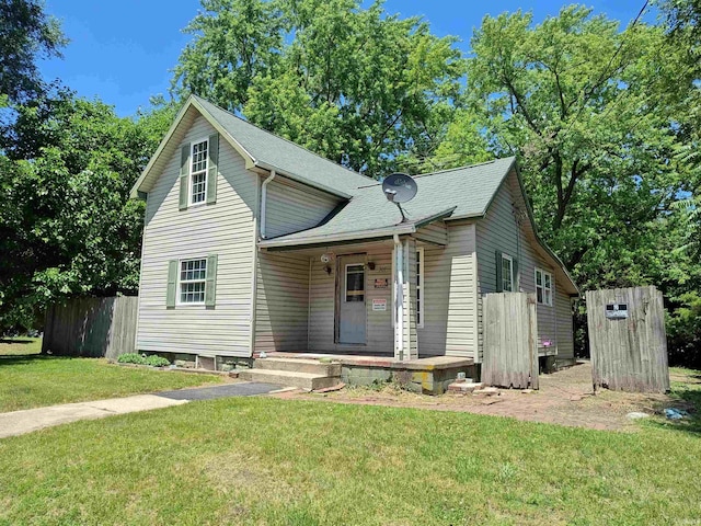 307 W Bender St, Knox, IN 46534 - view of front facade featuring a porch and a shingled roof
