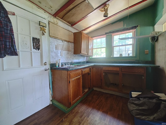 307 W Bender St, Knox, IN 46534 - kitchen with dark wood-style floors, brown cabinets, vaulted ceiling, and dark countertops