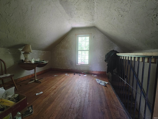 307 W Bender St, Knox, IN 46534 - bonus room with hardwood / wood-style flooring, vaulted ceiling, and a textured ceiling