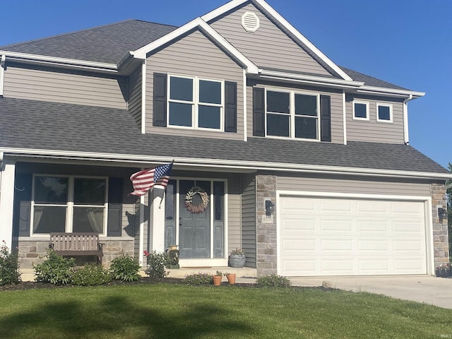17030 Hand Rd, Huntertown, IN 46748 - craftsman-style home with stone siding, driveway, roof with shingles, and an attached garage