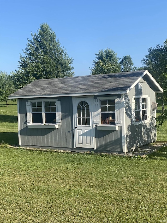 17030 Hand Rd, Huntertown, IN 46748 - view of front of house with a front lawn, an outdoor structure, and roof with shingles