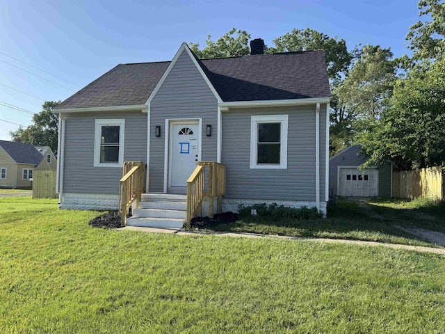 118 Burns Blvd, Fort Wayne, IN 46807 - view of front of home with a chimney, a front yard, a detached garage, and roof with shingles