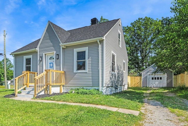 118 Burns Blvd, Fort Wayne, IN 46807 - view of front of house featuring a chimney, an outbuilding, a shingled roof, and a garage