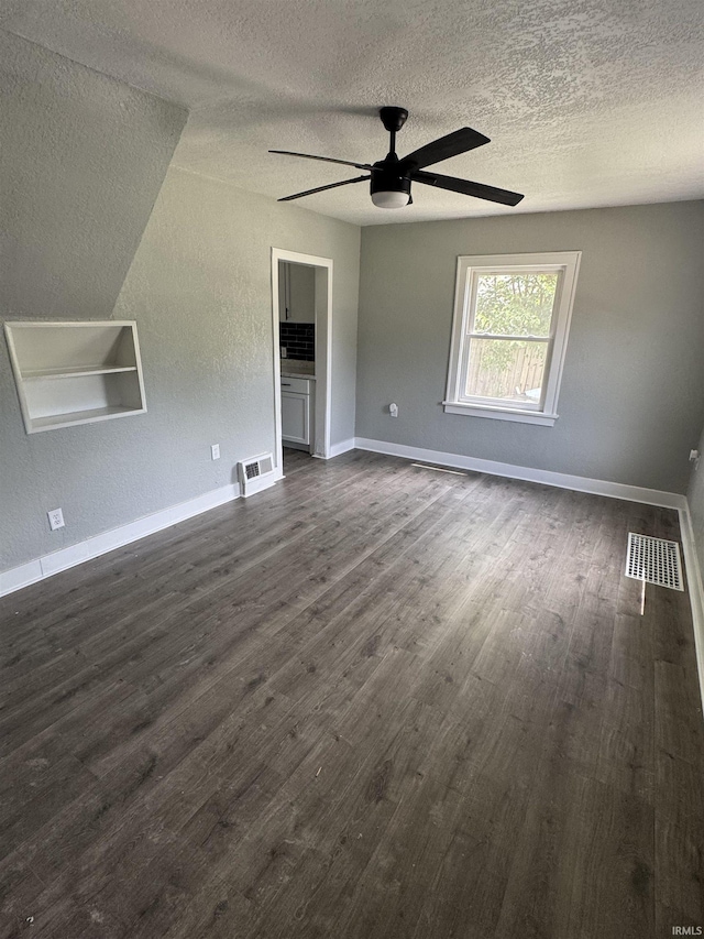 118 Burns Blvd, Fort Wayne, IN 46807 - empty room featuring a textured ceiling, dark wood finished floors, and ceiling fan