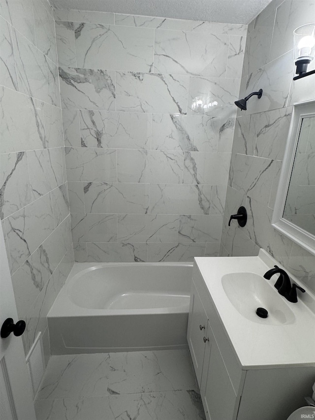 118 Burns Blvd, Fort Wayne, IN 46807 - bathroom with vanity, marble look tiles, tub / shower combination, and a textured ceiling