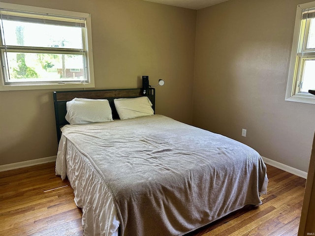 2407 Sherborne Blvd, Fort Wayne, IN 46805 - bedroom with multiple windows and wood finished floors