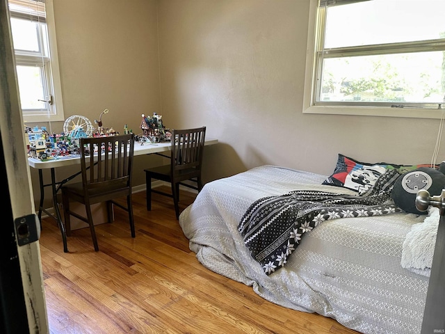 2407 Sherborne Blvd, Fort Wayne, IN 46805 - bedroom featuring wood finished floors and multiple windows