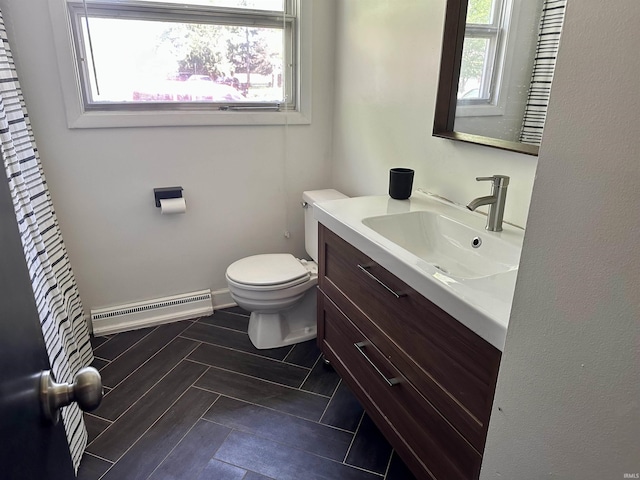 2407 Sherborne Blvd, Fort Wayne, IN 46805 - bathroom with a baseboard heating unit, vanity, and healthy amount of natural light