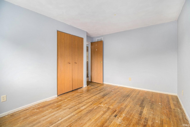 1822 Sherman Ave, South Bend, IN 46616 - unfurnished bedroom with wood finished floors and a closet