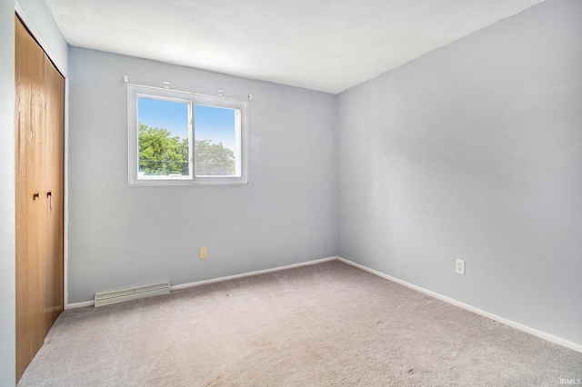 1822 Sherman Ave, South Bend, IN 46616 - unfurnished bedroom with a closet and carpet floors