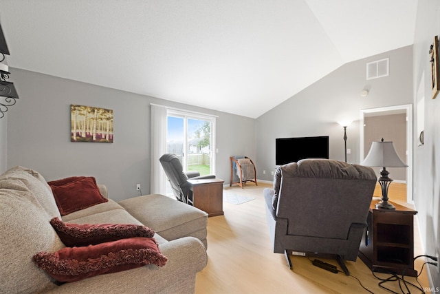8620 Shearwater Pass, Fort Wayne, IN 46825 - living room with light wood-style floors and lofted ceiling