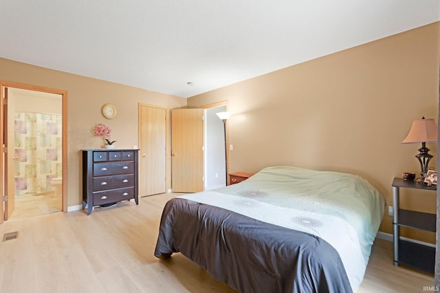 8620 Shearwater Pass, Fort Wayne, IN 46825 - bedroom with light wood finished floors and ensuite bathroom