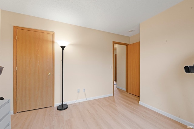 8620 Shearwater Pass, Fort Wayne, IN 46825 - unfurnished bedroom featuring light wood-type flooring and baseboards