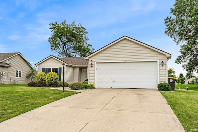 8620 Shearwater Pass, Fort Wayne, IN 46825 - ranch-style house featuring a front yard, a garage, and concrete driveway