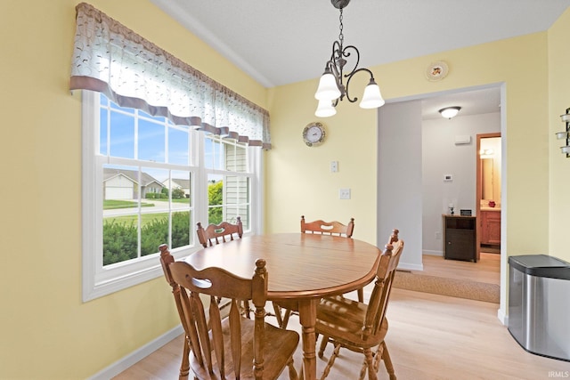 8620 Shearwater Pass, Fort Wayne, IN 46825 - dining room with a chandelier and light wood-style flooring