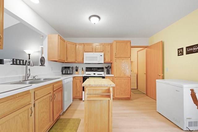 8620 Shearwater Pass, Fort Wayne, IN 46825 - kitchen featuring white appliances, light brown cabinets, a center island, light countertops, and light wood-type flooring