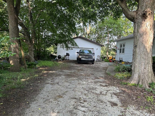 9219 N 100 W, West Lafayette, IN 47906 - view of front of property featuring an outbuilding, a detached garage, and dirt driveway
