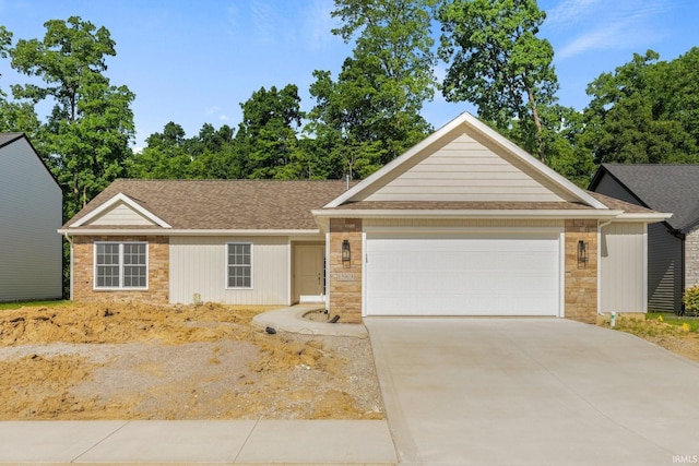 13969 Diavik Pl, Fort Wayne, IN 46845 - single story home with an attached garage, stone siding, concrete driveway, and a shingled roof