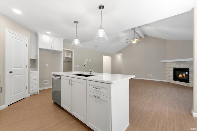 13969 Diavik Pl, Fort Wayne, IN 46845 - kitchen featuring stainless steel dishwasher, light wood-style floors, white cabinets, light countertops, and pendant lighting