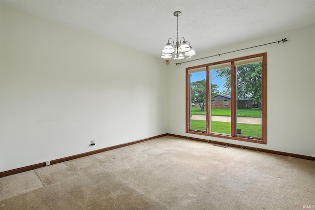 708 Forest Dr, Frankfort, IN 46041 - carpeted empty room with a chandelier and a textured ceiling