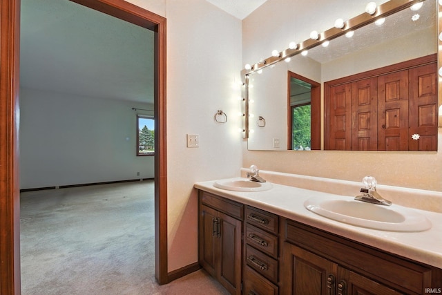 708 Forest Dr, Frankfort, IN 46041 - bathroom featuring double vanity and healthy amount of natural light