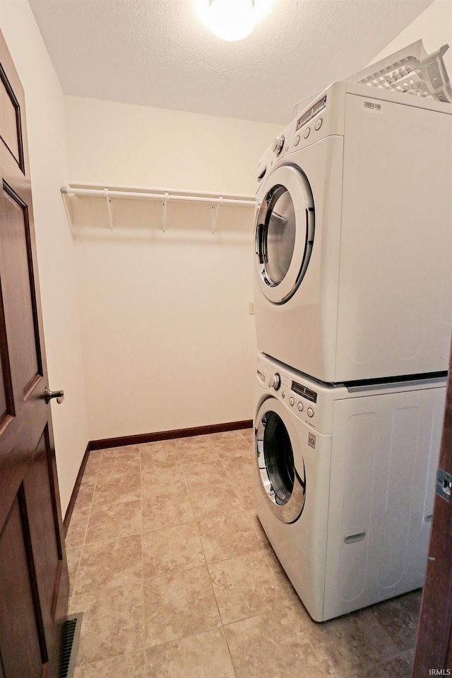 9932 N Meridian Line Rd, West Lafayette, IN 47906 - laundry room with estacked washer and dryer and baseboards