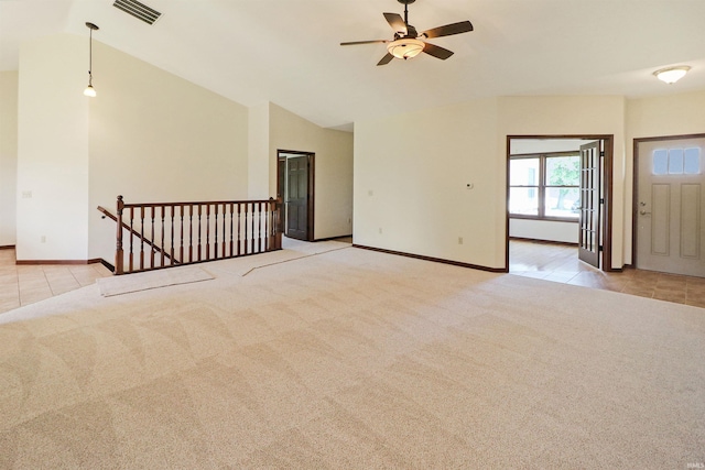 9932 N Meridian Line Rd, West Lafayette, IN 47906 - unfurnished living room featuring light carpet, a ceiling fan, lofted ceiling, and light tile patterned floors