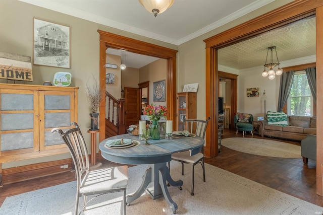 650 Main St, Rockport, IN 47635 - dining room featuring wood finished floors, ornamental molding, stairway, and a chandelier