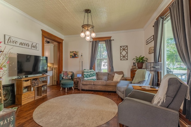 650 Main St, Rockport, IN 47635 - living room featuring wood finished floors, a chandelier, and ornamental molding