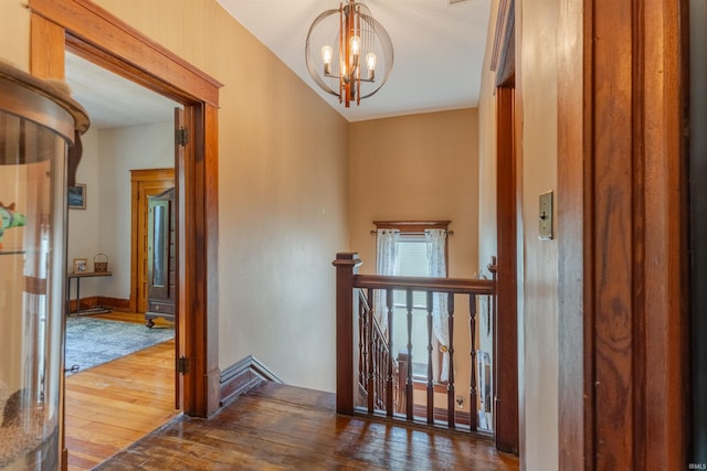 650 Main St, Rockport, IN 47635 - corridor with an upstairs landing, wood-type flooring, and a chandelier