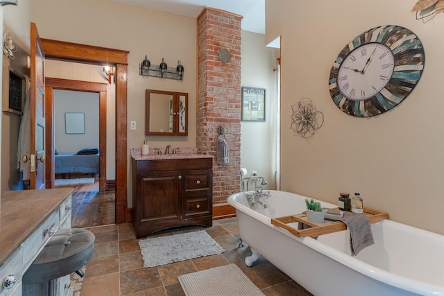 650 Main St, Rockport, IN 47635 - full bath with vanity, a freestanding tub, and stone finish floors