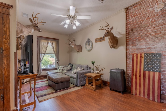 650 Main St, Rockport, IN 47635 - living area with wood finished floors, a ceiling fan, and ornamental molding