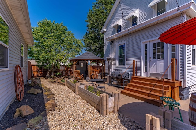 650 Main St, Rockport, IN 47635 - view of patio / terrace featuring a gazebo, grilling area, and a garden